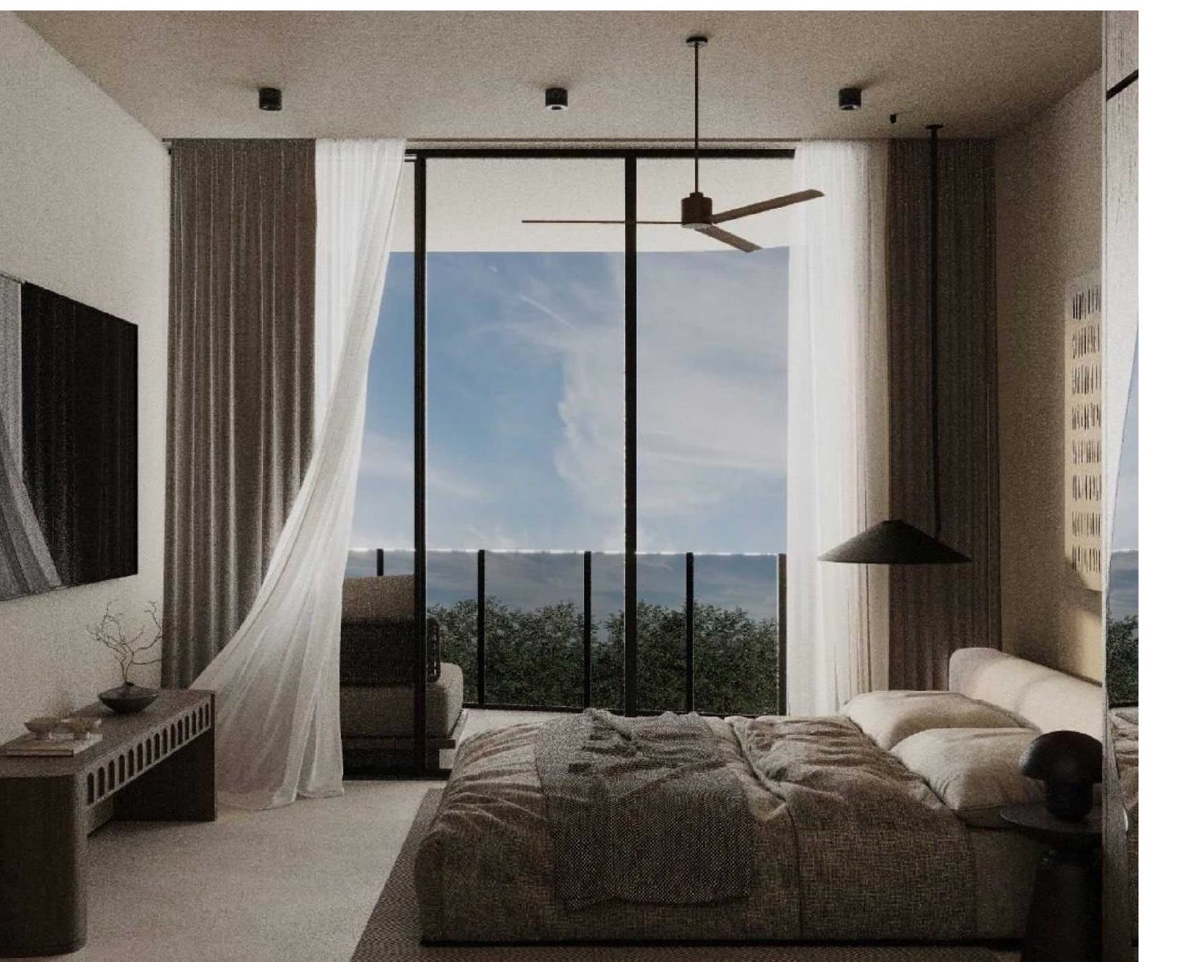Studio residence bedroom with ocean-facing curtains, Luma Biohacking Resort